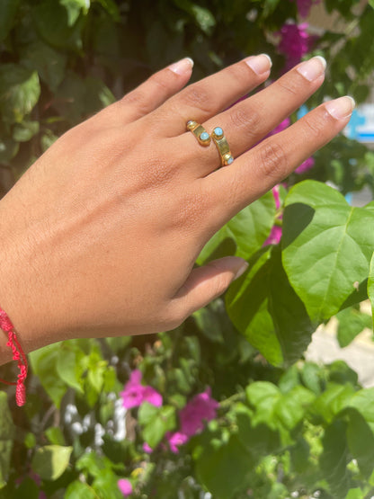 womans hand wearing the 18k gold plated sterling silver open ring on her middle finger. High class and fashionable Girly Statement Ring.