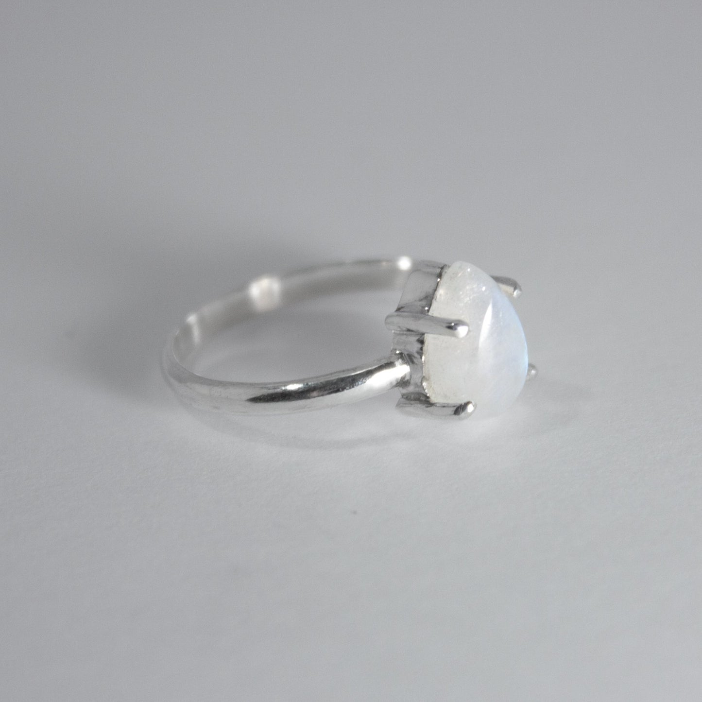 Rainbow Moonstone Pear Claw Sterling Silver Ring